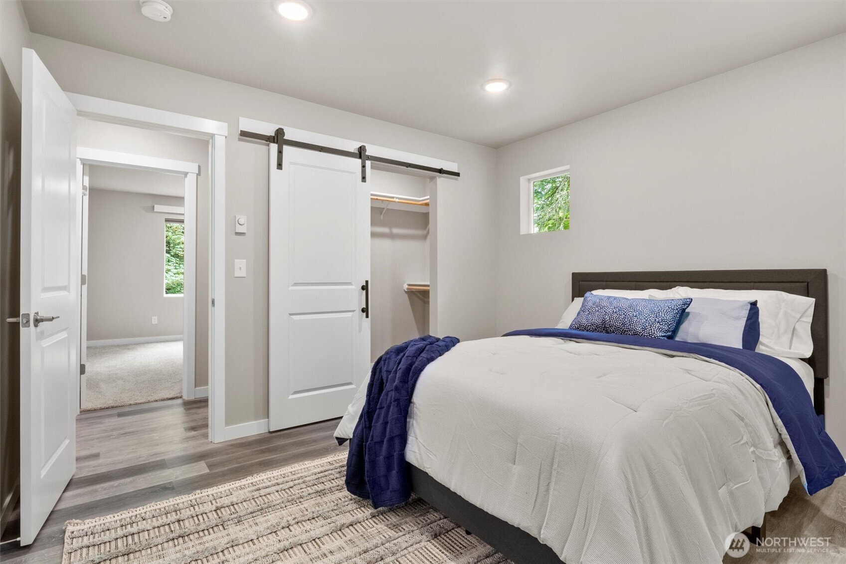 38 Harborview Drive Bellingham, WA 98229 - Photo 6 of 39 a spacious bedroom with a bed and a shower