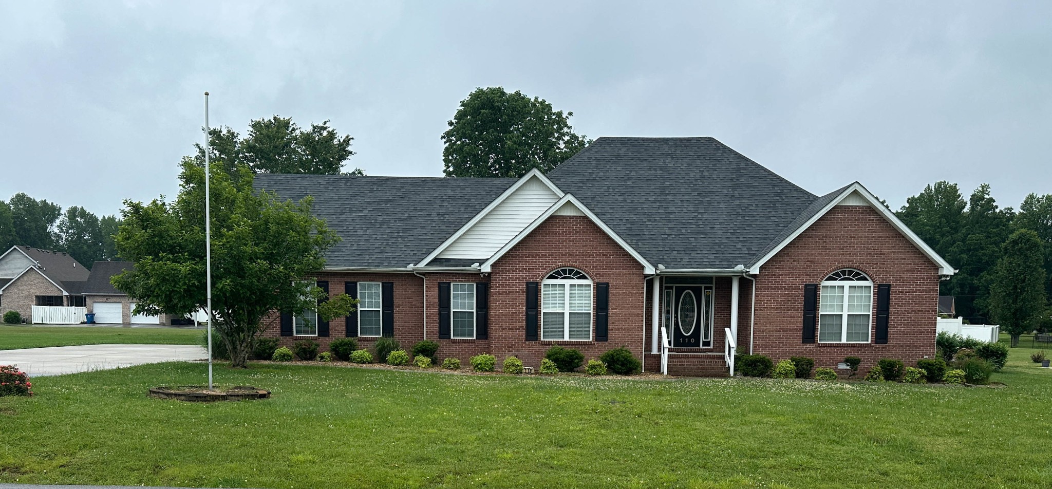 110 Post Road Manchester, TN 37355 - Photo 1 of 68 a front view of a house with a yard