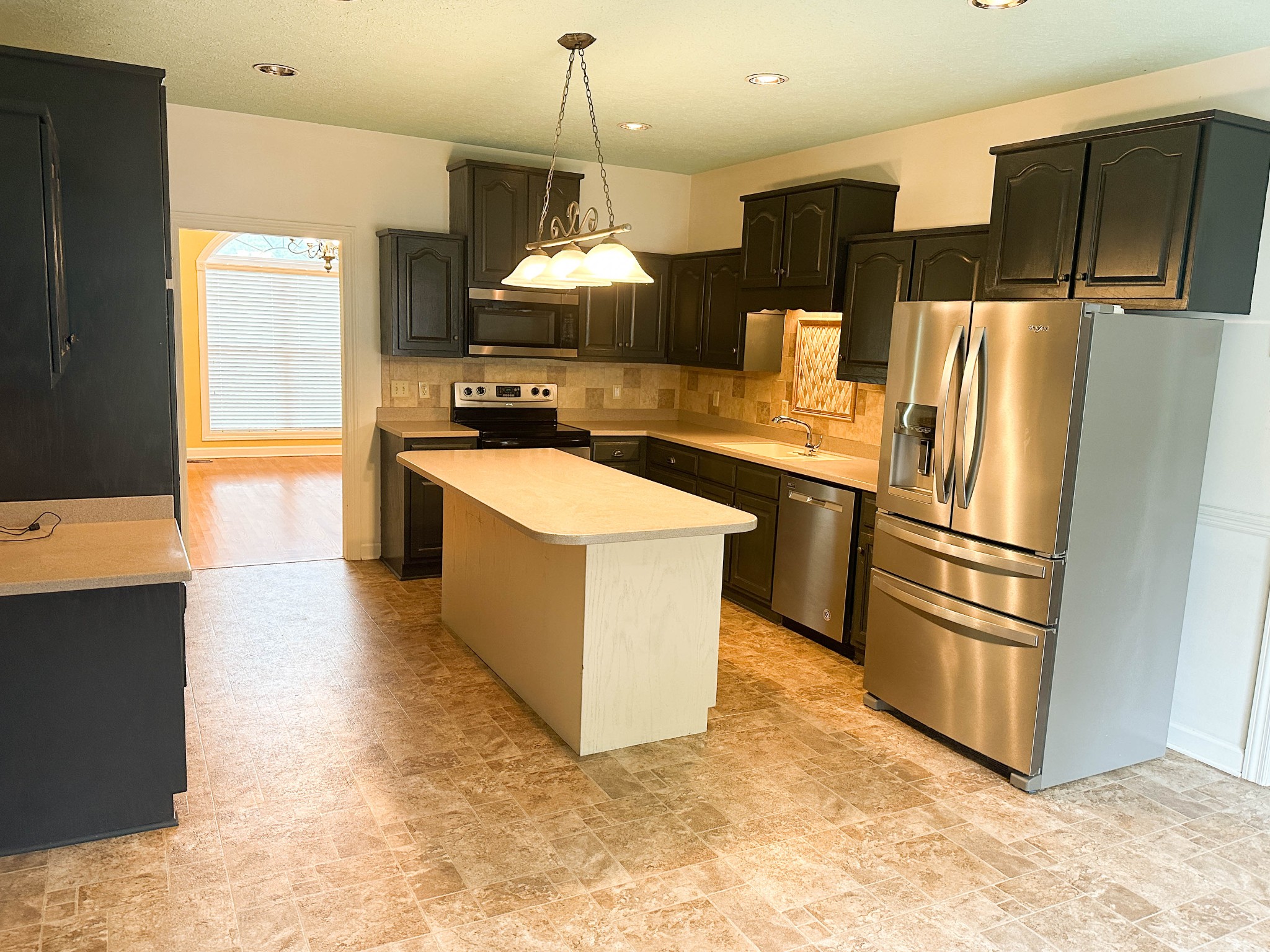 110 Post Road Manchester, TN 37355 - Photo 11 of 68 a kitchen with stainless steel appliances a refrigerator a stove a sink and a refrigerator