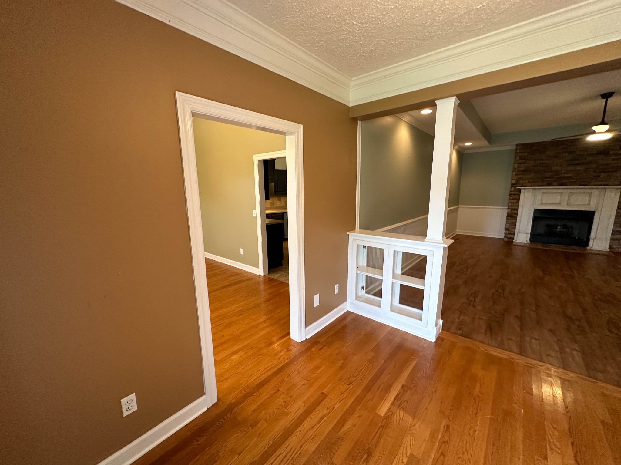110 Post Road Manchester, TN 37355 - Photo 17 of 68 wooden floor in an empty room with a fireplace