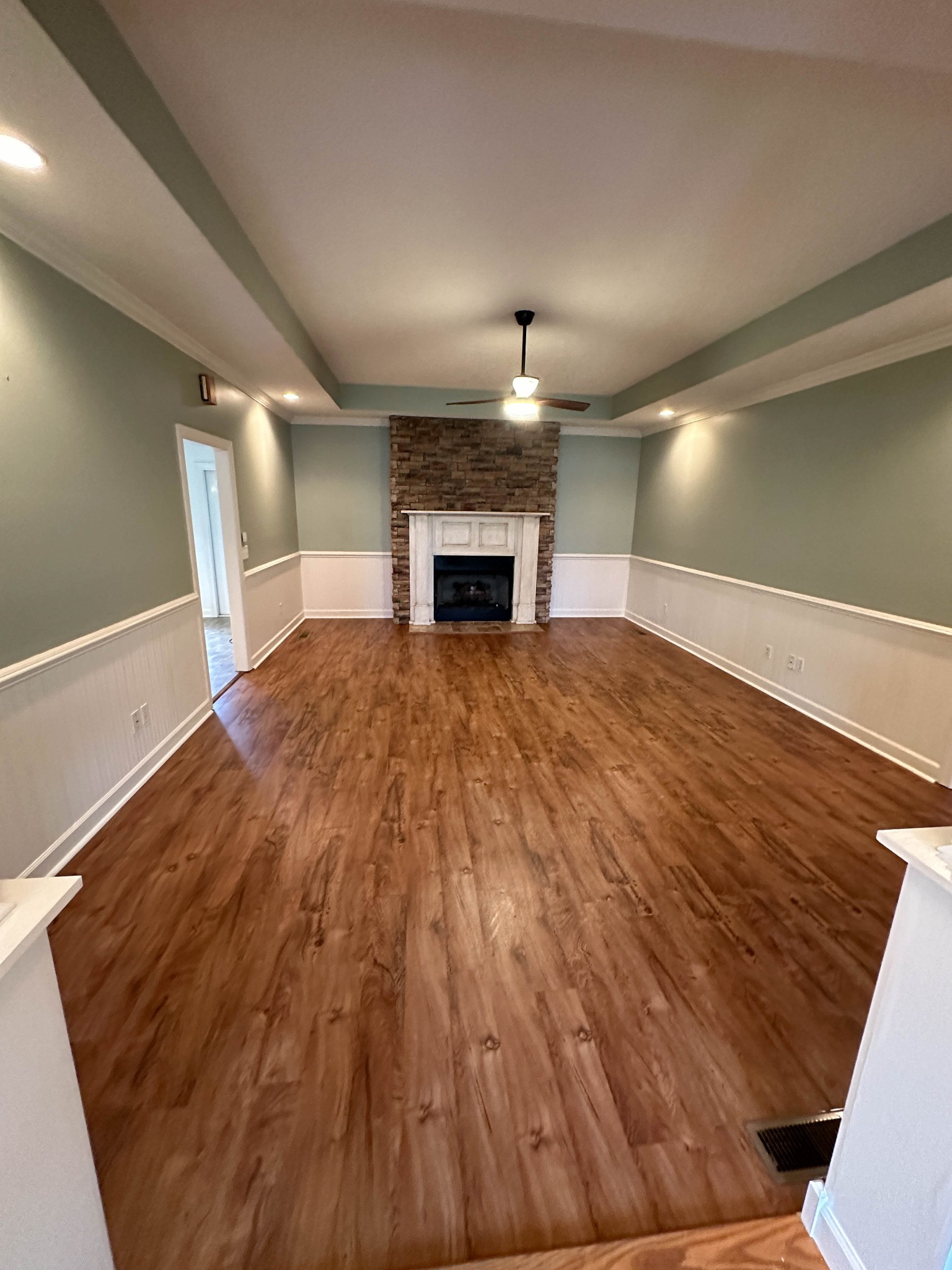 110 Post Road Manchester, TN 37355 - Photo 19 of 68 a view of empty room with wooden floor and fireplace