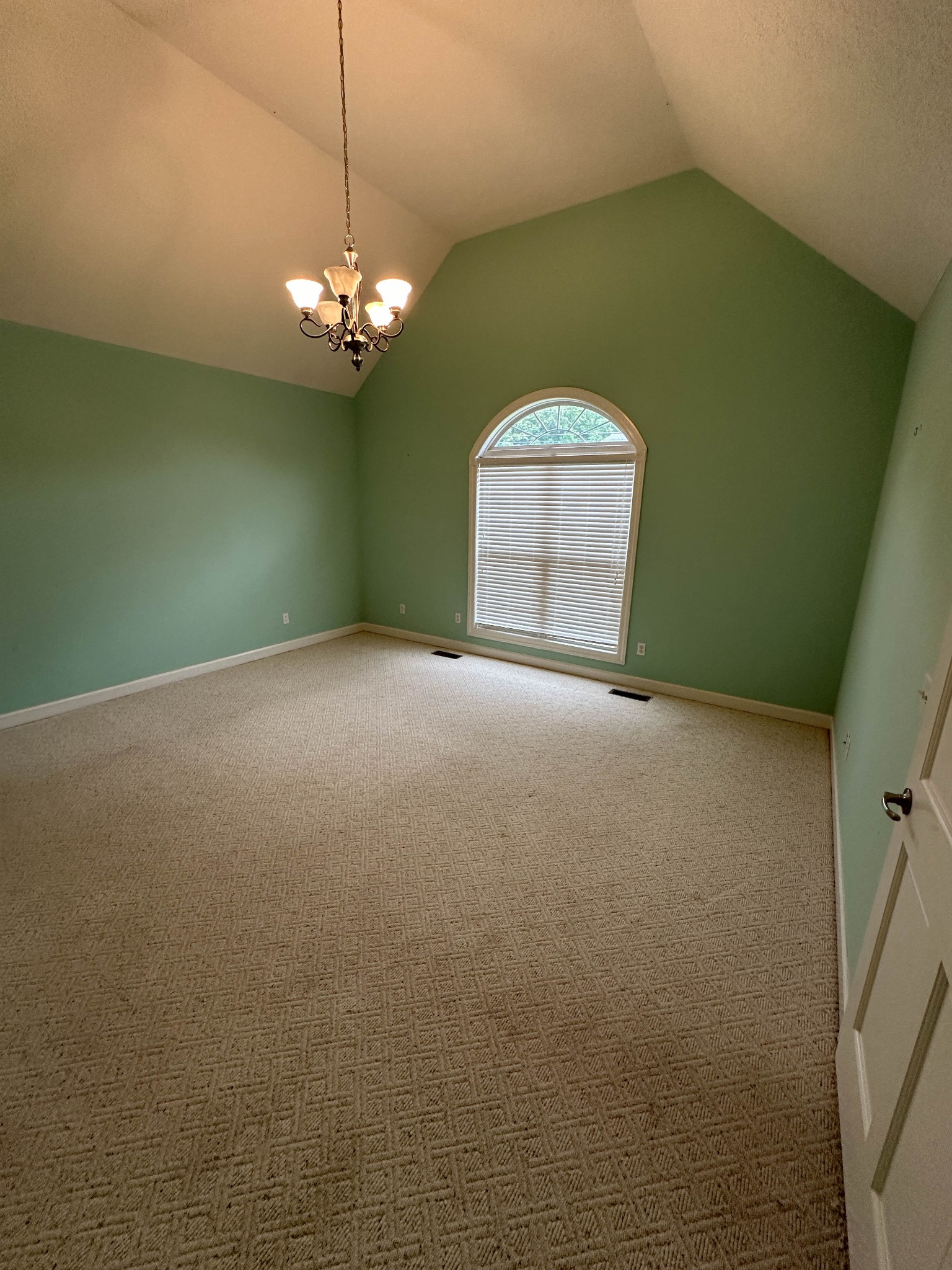 110 Post Road Manchester, TN 37355 - Photo 27 of 68 a view of a room with a chandelier fan and a kitchen