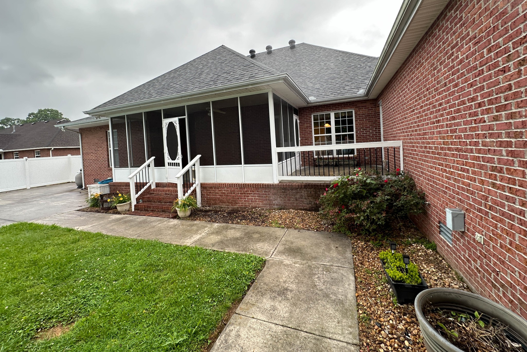 110 Post Road Manchester, TN 37355 - Photo 63 of 68 a front view of a house with a garden and patio