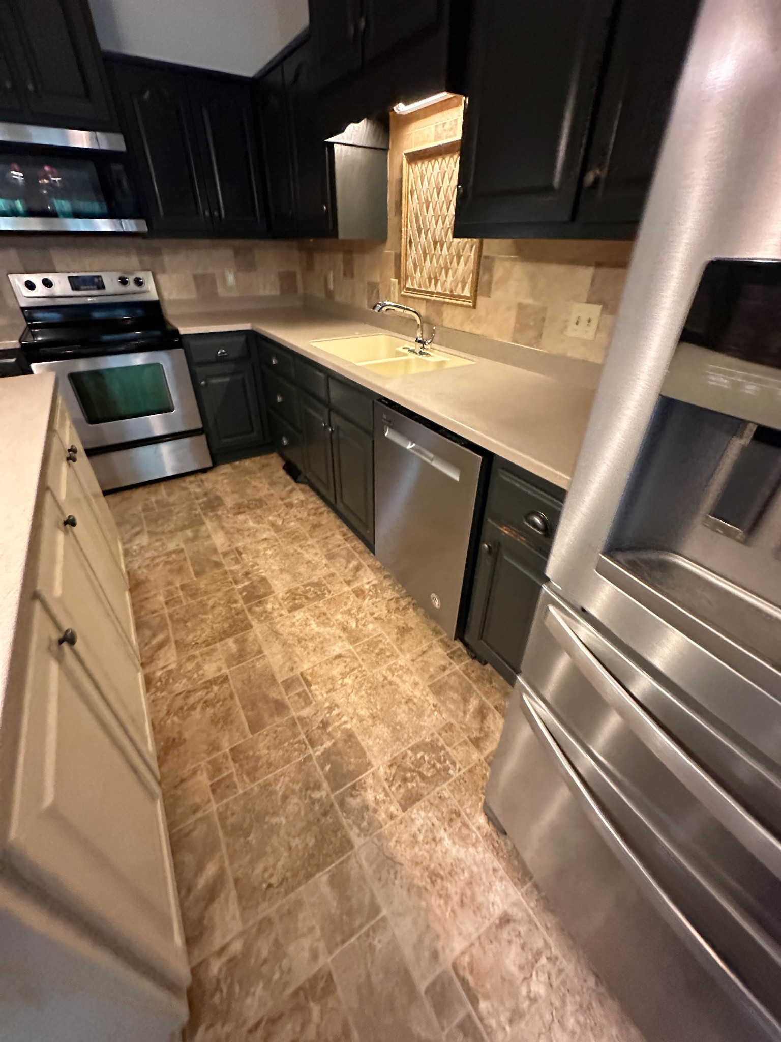 110 Post Road Manchester, TN 37355 - Photo 65 of 68 a kitchen with granite countertop a sink and cabinets