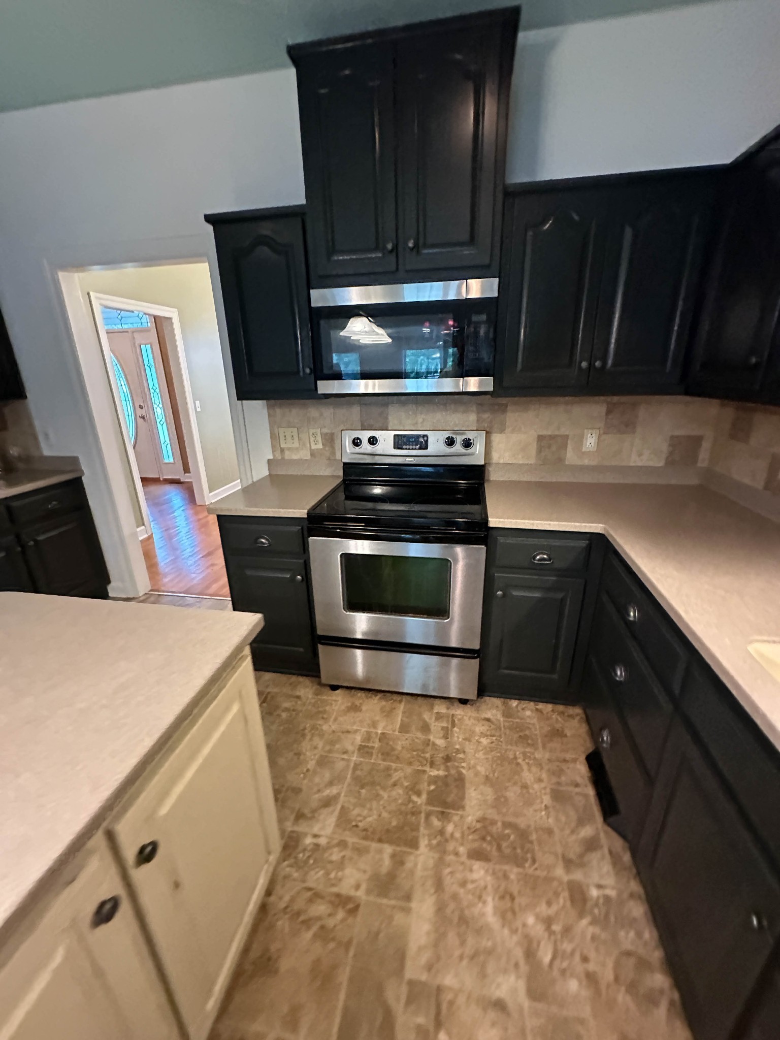 110 Post Road Manchester, TN 37355 - Photo 66 of 68 a kitchen with granite countertop a stove and a sink