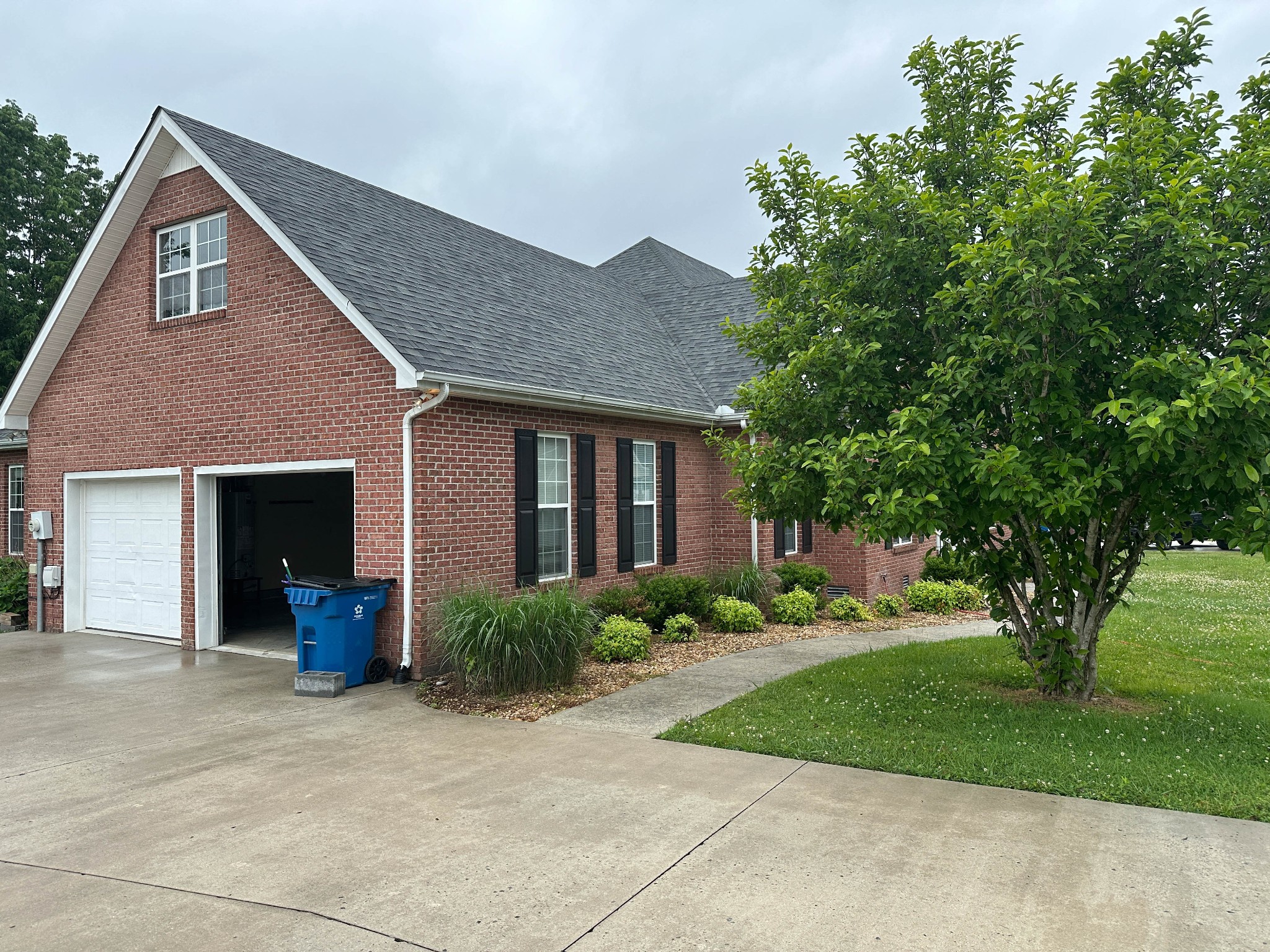 110 Post Road Manchester, TN 37355 - Photo 7 of 68 a front view of a house with a yard and tree