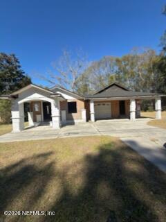 541 Highway 90 Baldwin, FL 32234 - Photo 2 of 14 a front view of a house with a yard