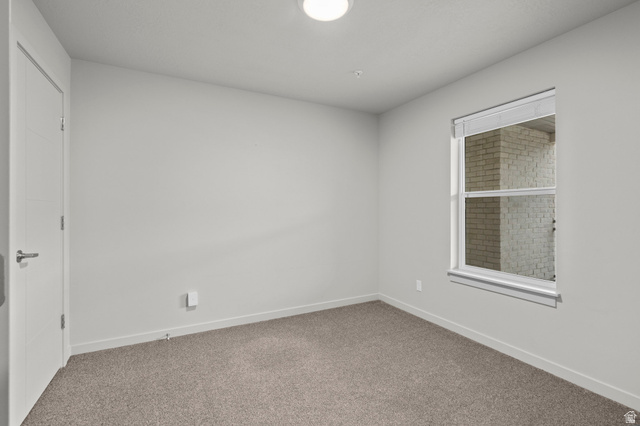 64 West 600 South, Unit C205 Springville, UT 84663 - Photo 14 of 28 Empty room featuring carpet flooring and baseboards