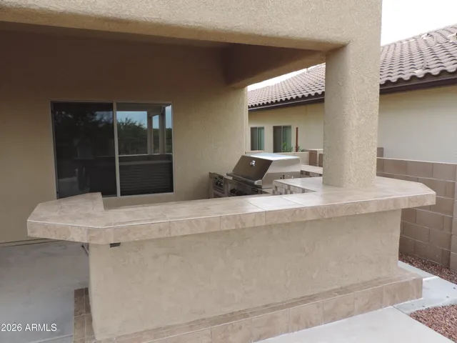 a view of a pathway with a garden