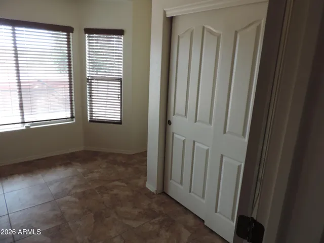 a view of an empty room with windows