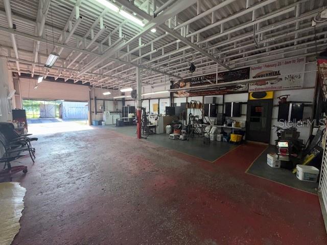 644 Maguire Road Ocoee, FL 34761 - Photo 19 of 34 a view of a room with gym equipment