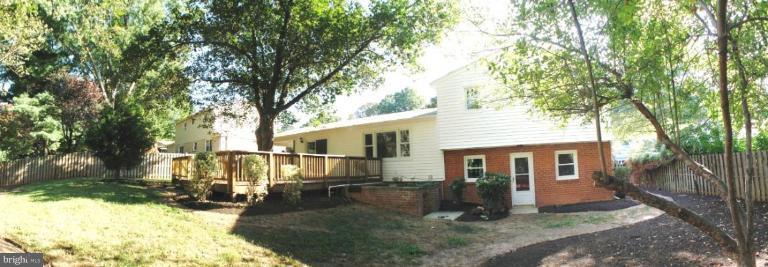 6807 Sydenstricker Road Springfield, VA 22152 - Photo 4 of 7 front view of a house with a yard