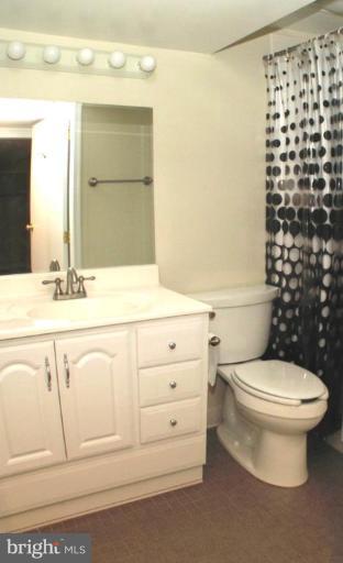 6807 Sydenstricker Road Springfield, VA 22152 - Photo 6 of 7 a bathroom with a sink a toilet and shower