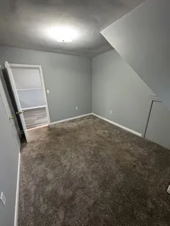 an empty room with a empty space and a window