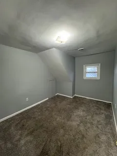 an empty room with a bathroom
