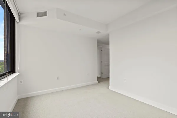 a view of a bathroom with a glass shower door