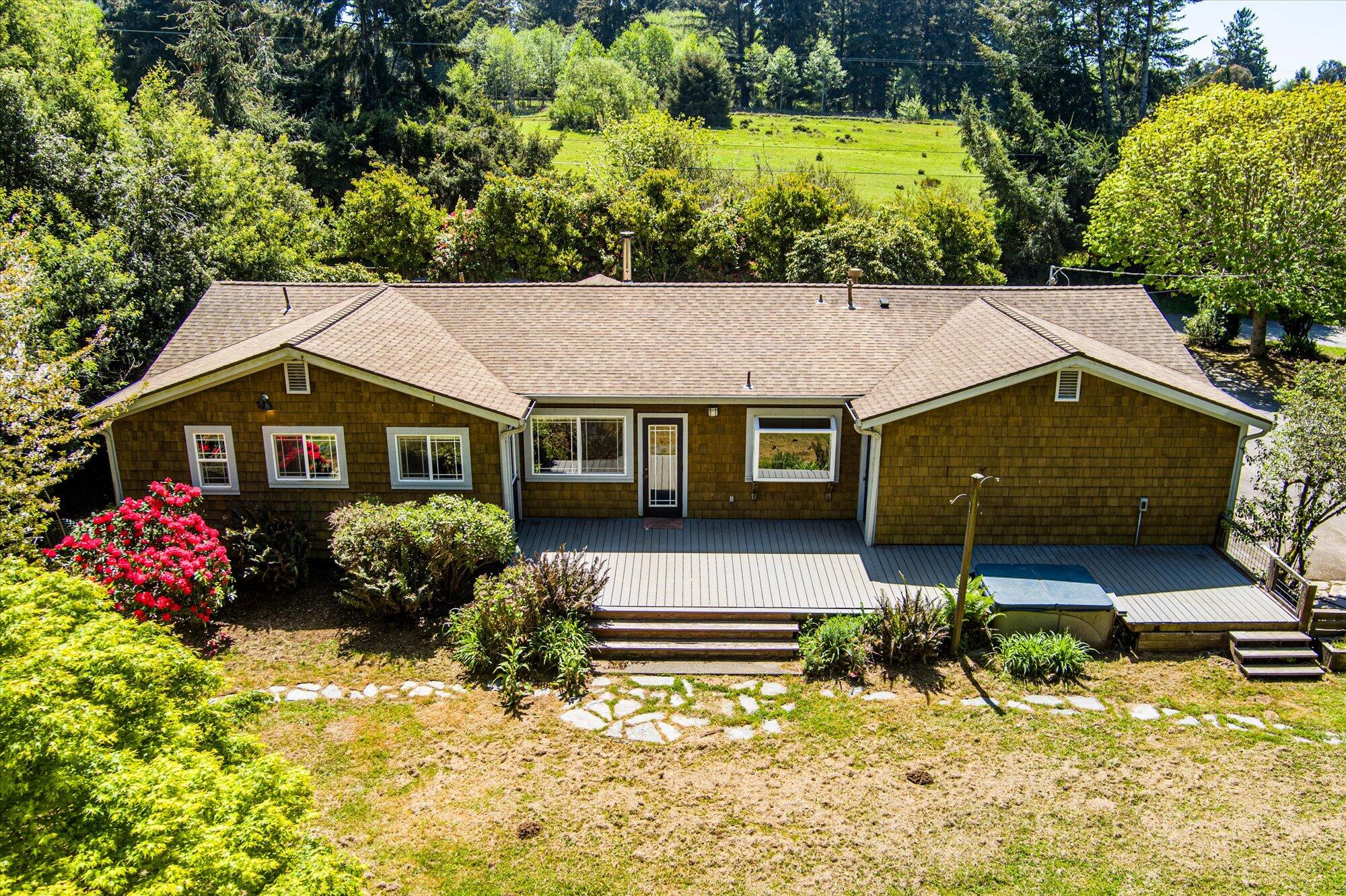 1945 Grange Road McKinleyville, CA 95519 - Photo 44 of 62 a front view of house with yard and trees in the background