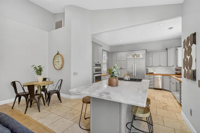 a spacious bathroom with a double vanity sink and a bathtub