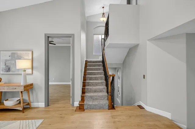 a bathroom with a tub sink and mirror
