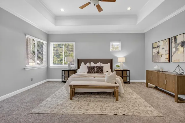 a bathroom with a tub a double vanity sink a mirror and a bathtub