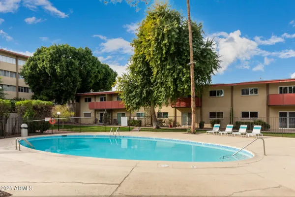 a view of outdoor space with swimming pool and porch
