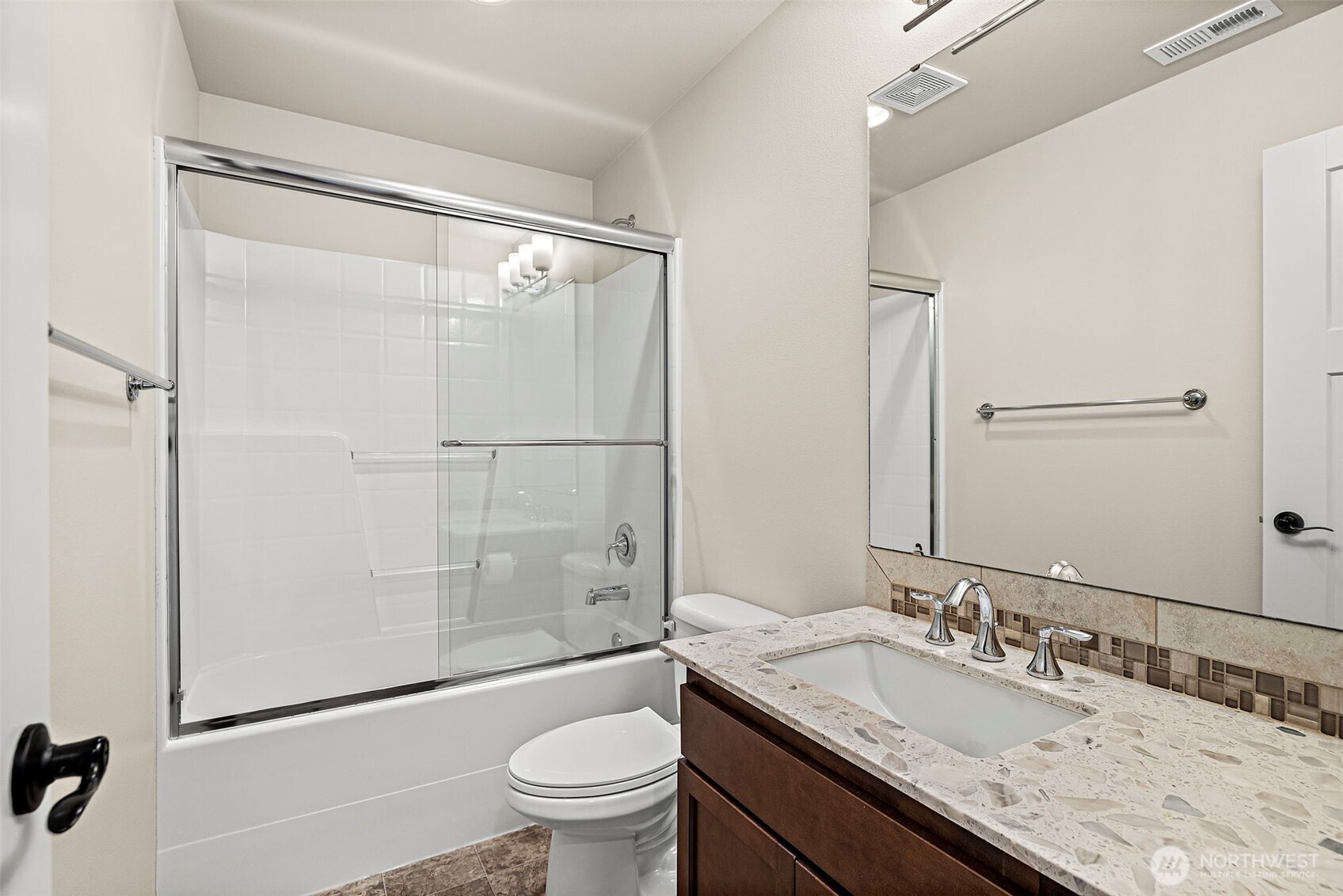 4708 167th Street Southwest Edmonds, WA 98026 - Photo 18 of 23 a bathroom with a granite countertop sink mirror toilet and shower
