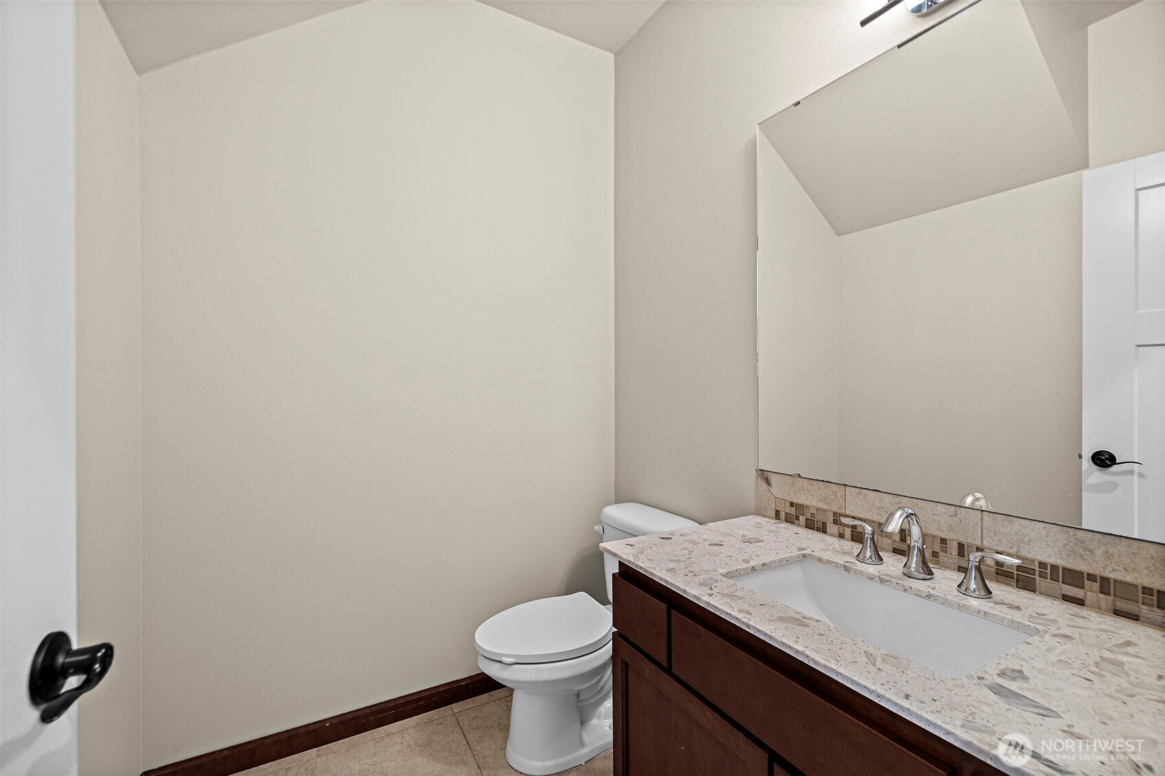 4708 167th Street Southwest Edmonds, WA 98026 - Photo 8 of 23 a bathroom with a granite countertop sink a toilet and a mirror