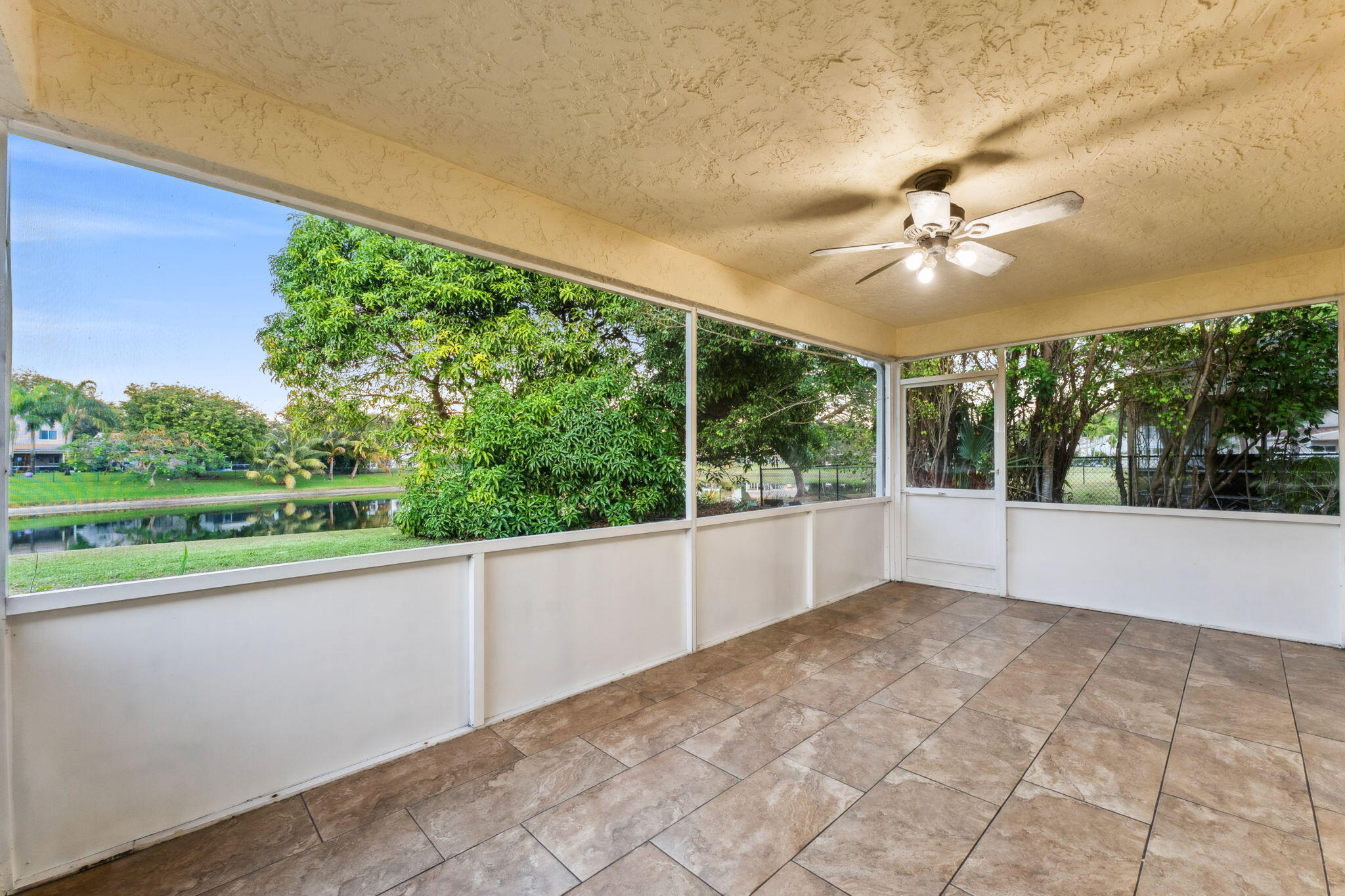 3855 Sabal Lakes Road Delray Beach, FL 33445 - Photo 23 of 31 Screened Patio