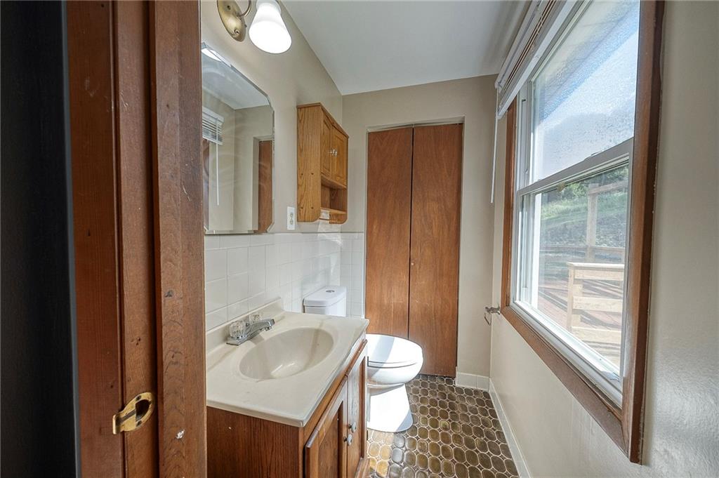 210 Swiontek Road Aliquippa, PA 15001 - Photo 16 of 28 a bathroom with a sink and a mirror