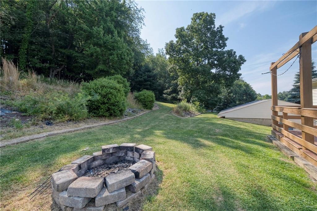 210 Swiontek Road Aliquippa, PA 15001 - Photo 24 of 28 a view of a backyard with plants and a garden