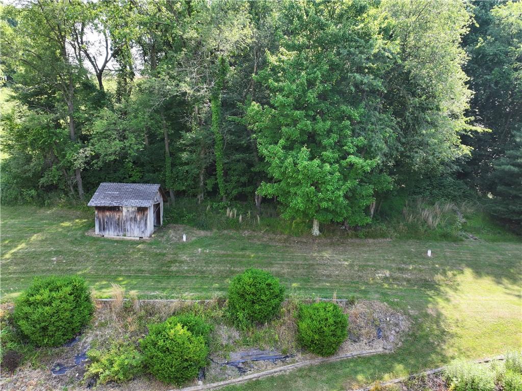 210 Swiontek Road Aliquippa, PA 15001 - Photo 25 of 28 a backyard of a house with a yard and outdoor seating