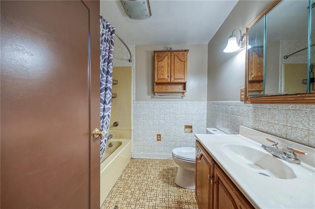 210 Swiontek Road Aliquippa, PA 15001 - Photo 9 of 28 a bathroom with a sink toilet and shower