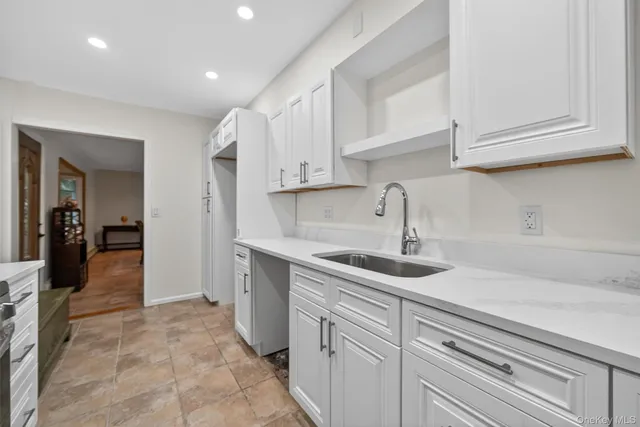 a kitchen with stainless steel appliances granite countertop a sink and dishwasher