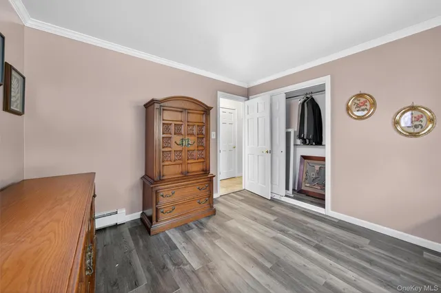 a view of a livingroom with wooden furniture