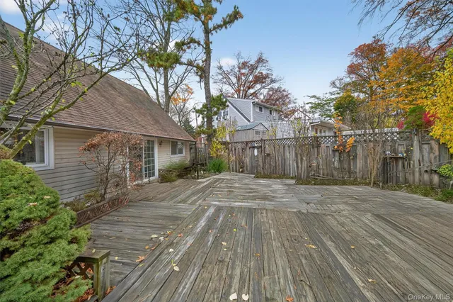 a view of house with basketball court
