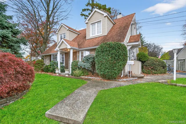 a view of a front of a house with a yard
