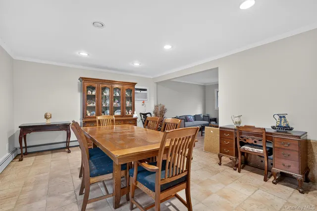 a dining room with a table and chairs