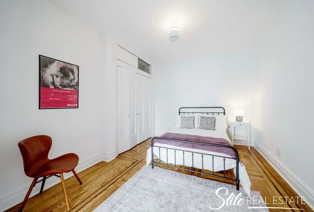 a room with a fireplace and a walk in closet