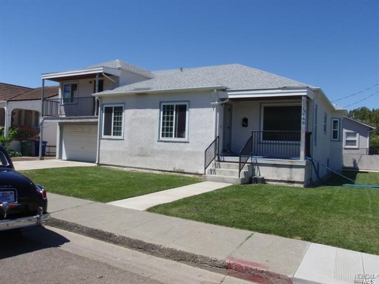 148 North 3rd Street Rio Vista, CA 94571 - Photo 1 of 1 a front view of a house with a yard