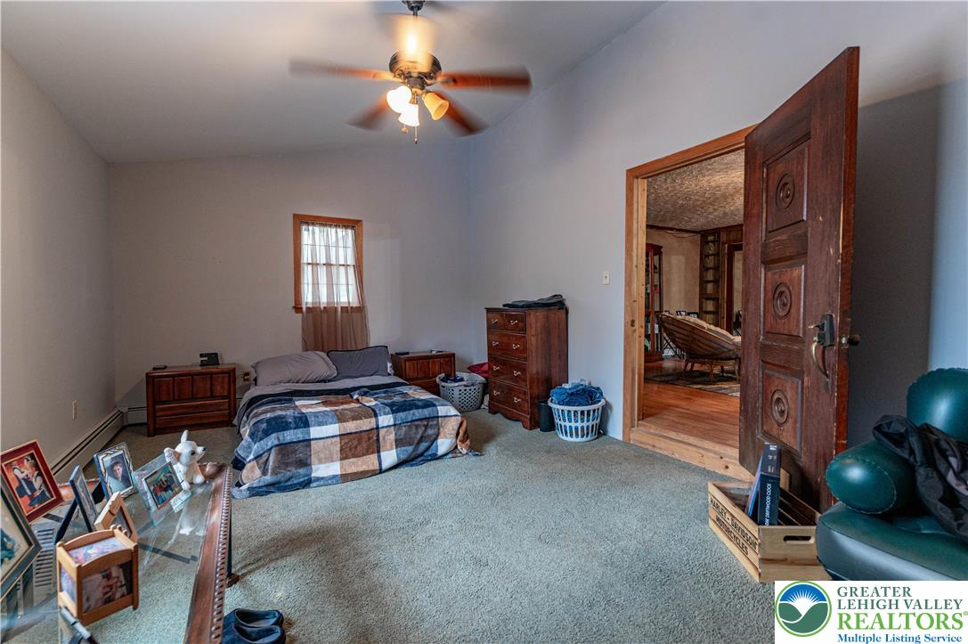 2485 Hieter Road Quakertown, PA 18951 - Photo 66 of 97 Comfortable bedroom with ample natural light and a functional ceiling fan.