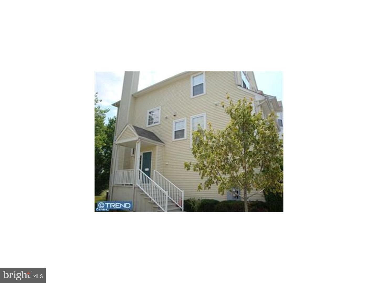 a picture of a bench in front of a building