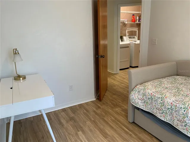 a bedroom with a bed and a sink