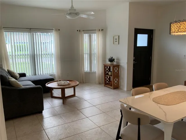 a living room with furniture and a window