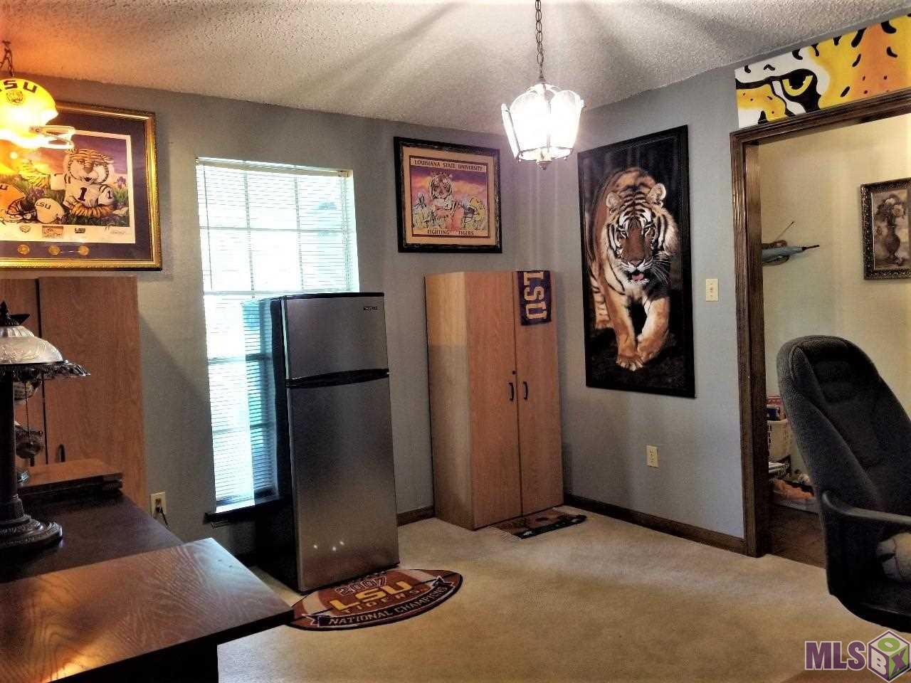 13706 Cypress Ridge Avenue Baton Rouge, LA 70817 - Photo 28 of 41 Formal Dining Room is currently the seller's LSU Room!