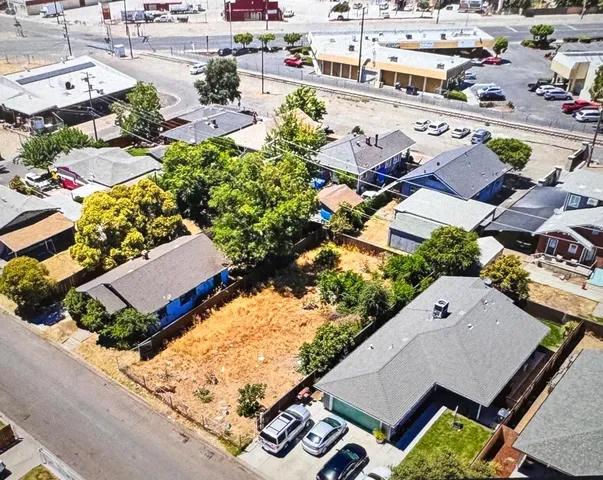 an aerial view of a house with a swimming pool