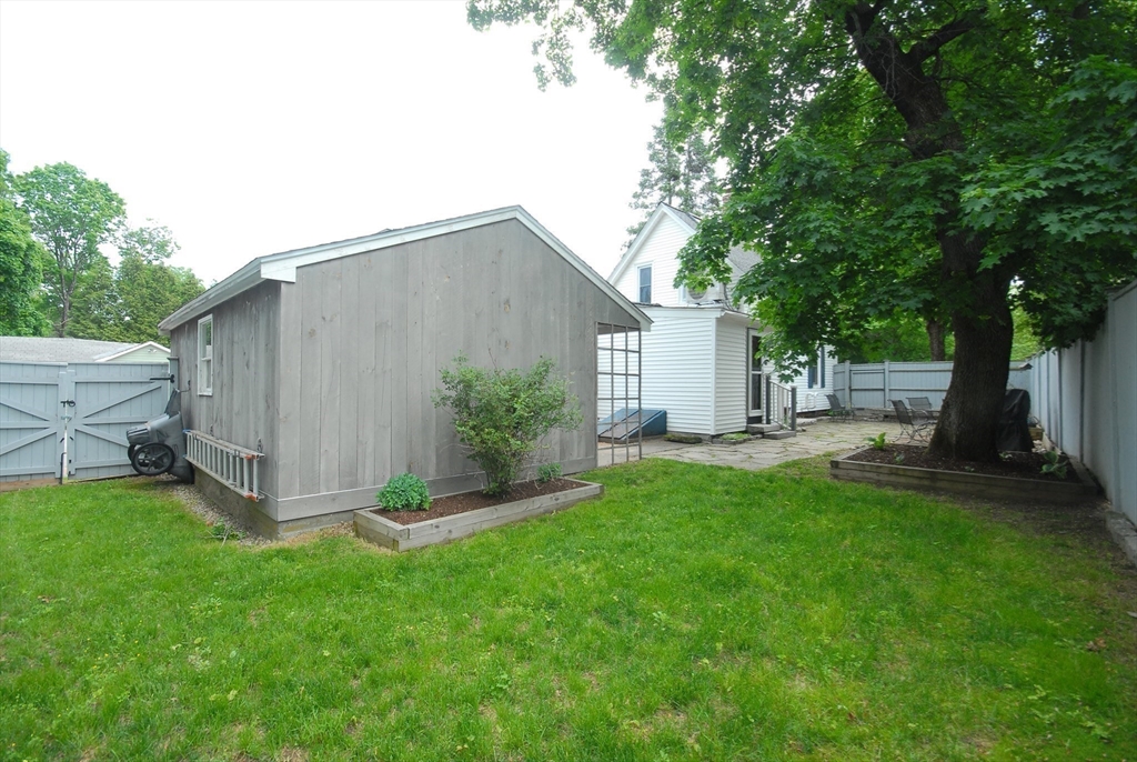 1832 Main Street Concord, MA 01742 - Photo 13 of 25 a view of backyard with potted plants and a large tree