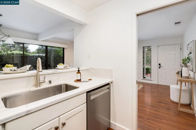 a kitchen with a stove and cabinets