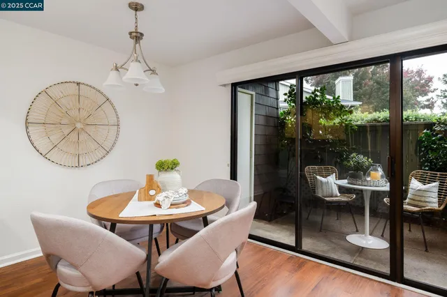 a view of a dining room with furniture window and outside view