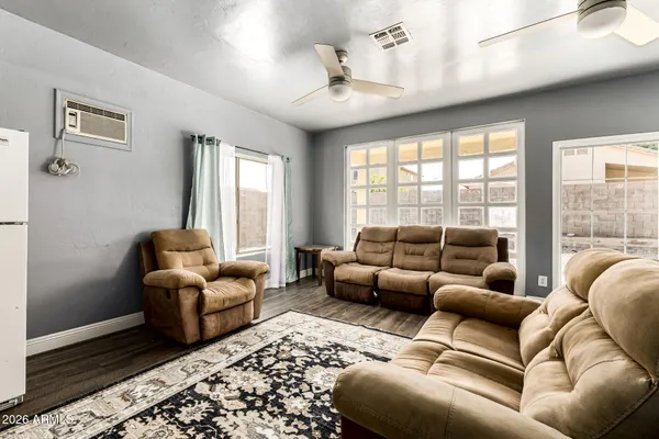 a living room with furniture and a large window