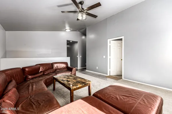 a bedroom with furniture and a rug